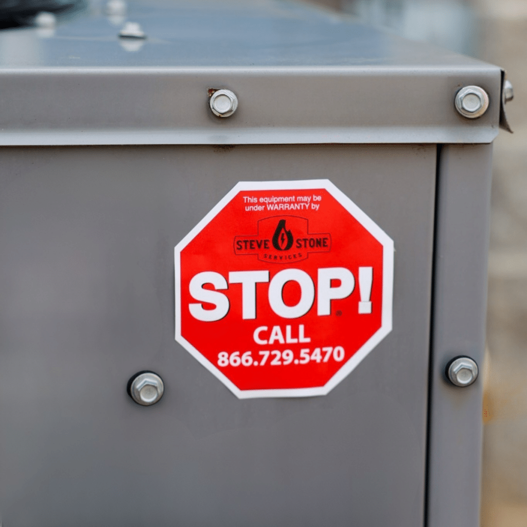 Red Stop Sticker on HVAC Unit