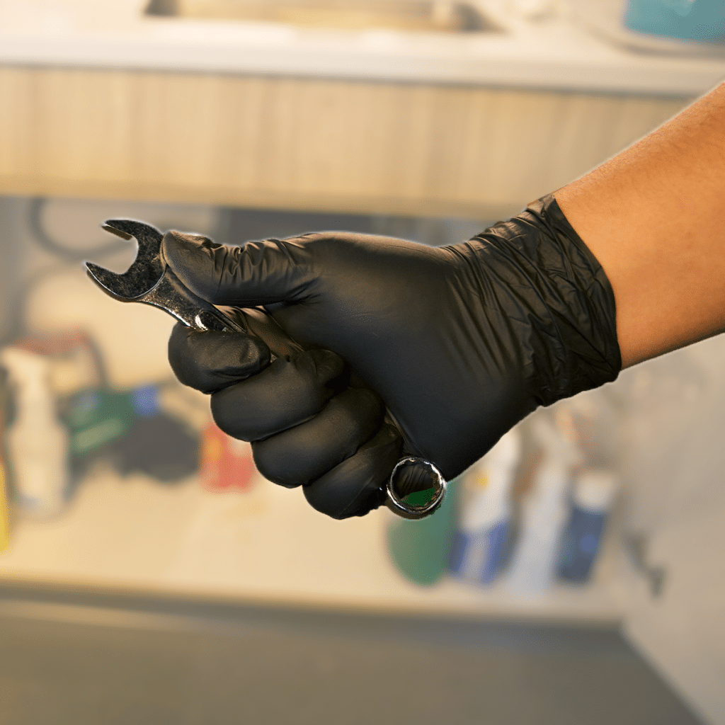 Black Gauntlet Silver Glove Holding Wrench
