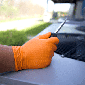 Orangathang Gloves Holding Screwdriver