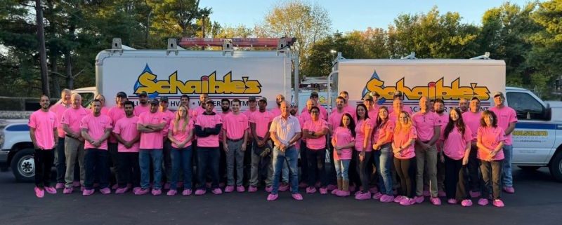 Pink shoe covers being worn in support of breast cancer awareness